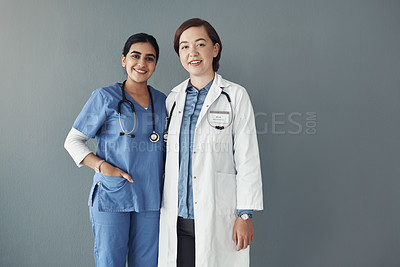 Buy stock photo Women, doctor or nurse in portrait on backdrop for medical with stethoscope, healthy team for wellness. Female people, medicine or healthcare workers in studio, intern with mentor for surgery