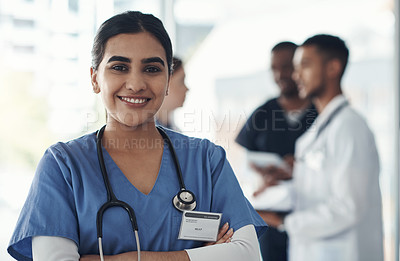 Buy stock photo Portrait, confident nurse and happy woman in hospital for healthcare career, wellness and proud doctor. Face, smile and medical professional with arms crossed, surgeon or expert employee coworking