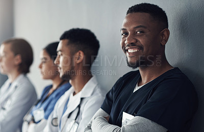 Buy stock photo Portrait, nurse and happy man in hospital for healthcare career, wellness or service with team. Face, smile and medical professional doctor, surgeon or expert employee coworking in clinic with group