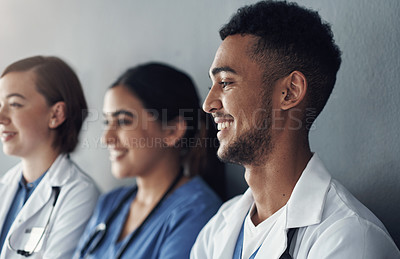 Buy stock photo Row, doctors and happy team by wall for interview or public health conference and training session or meeting. People, medical staff and line for patient rounds or daily briefing, review and proud.