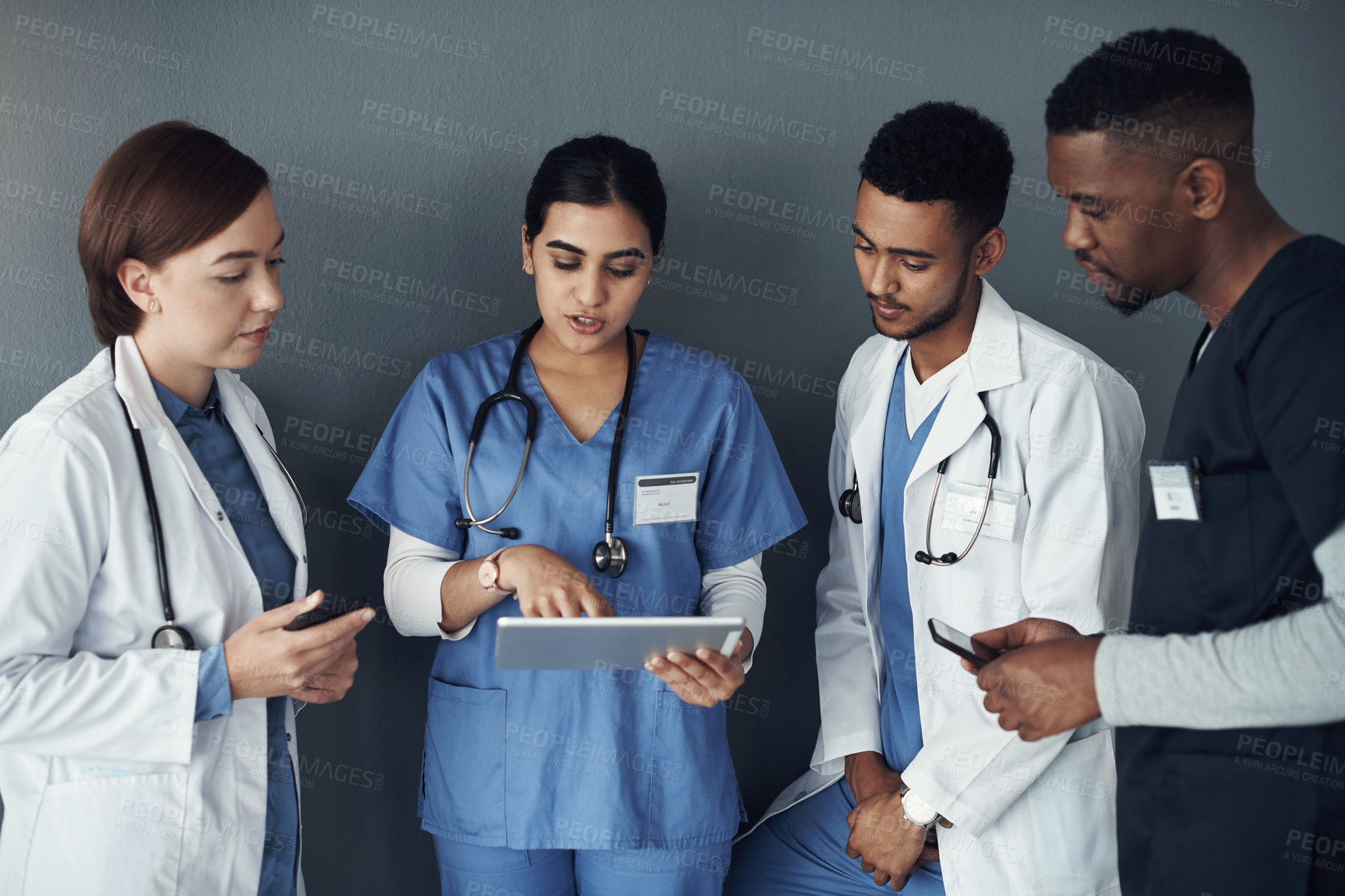 Buy stock photo Doctor, teamwork and tablet for medical research, planning and telehealth services on wall background. Healthcare worker, group and nurse with digital software for cancer trial, results and progress