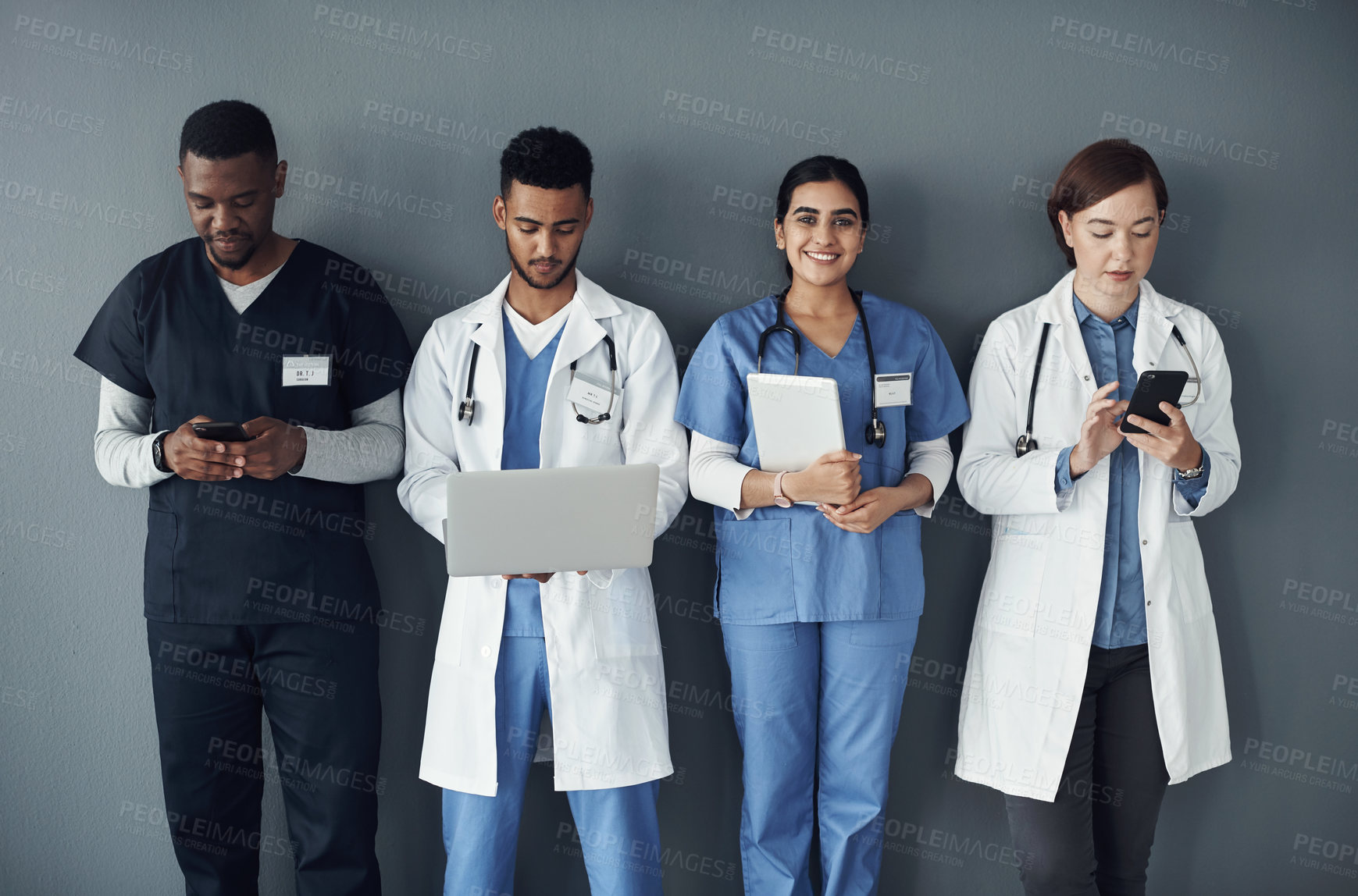 Buy stock photo Doctor, nurse and teamwork or planning on tech for medical research, workflow and wall background. Portrait of healthcare worker, group or staff on laptop, tablet and phone for internship opportunity