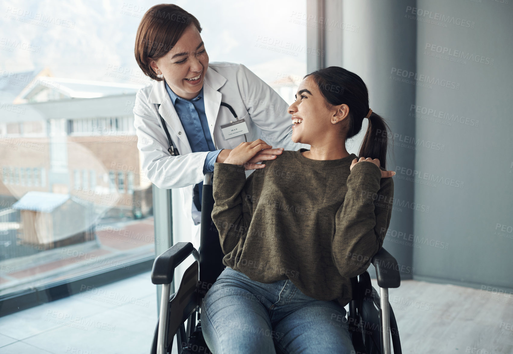 Buy stock photo Wheelchair, doctor and care for patient with disability in hospital for mobility impairment, empathy and support for healthcare. Medical worker, girl and happy for kindness, sympathy and recovery.