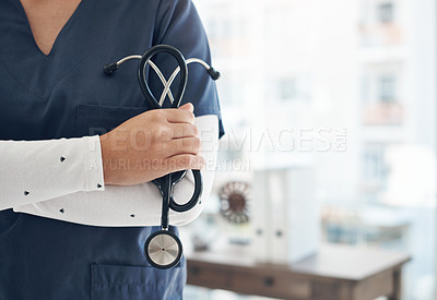 Buy stock photo Shot of an unrecognizable doctor holding a stethoscope in an office