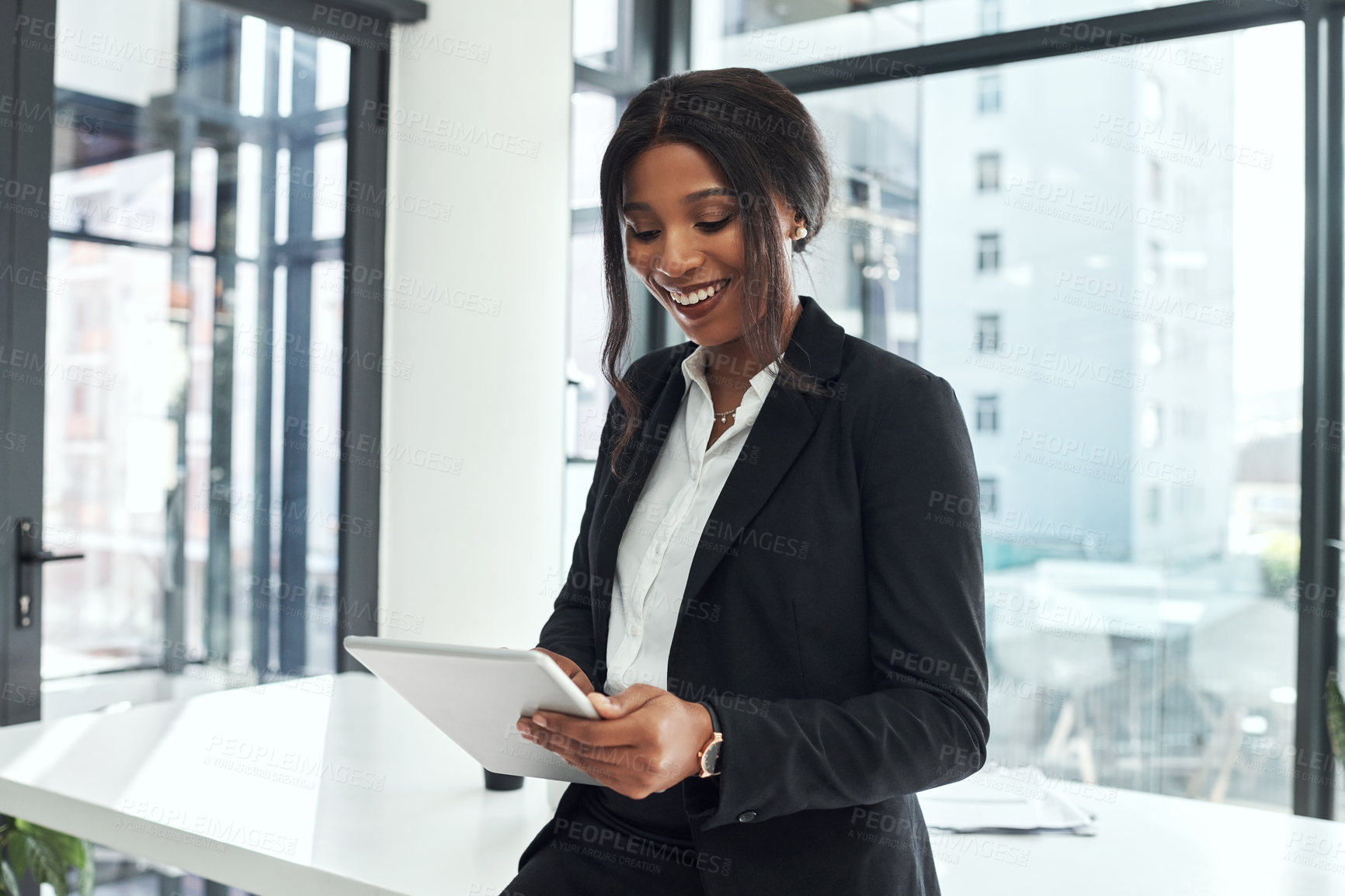 Buy stock photo Happy, lawyer and black woman in office with tablet for legal research, planning and reminder in app. Reading, news and professional attorney typing business email, networking or search for contact