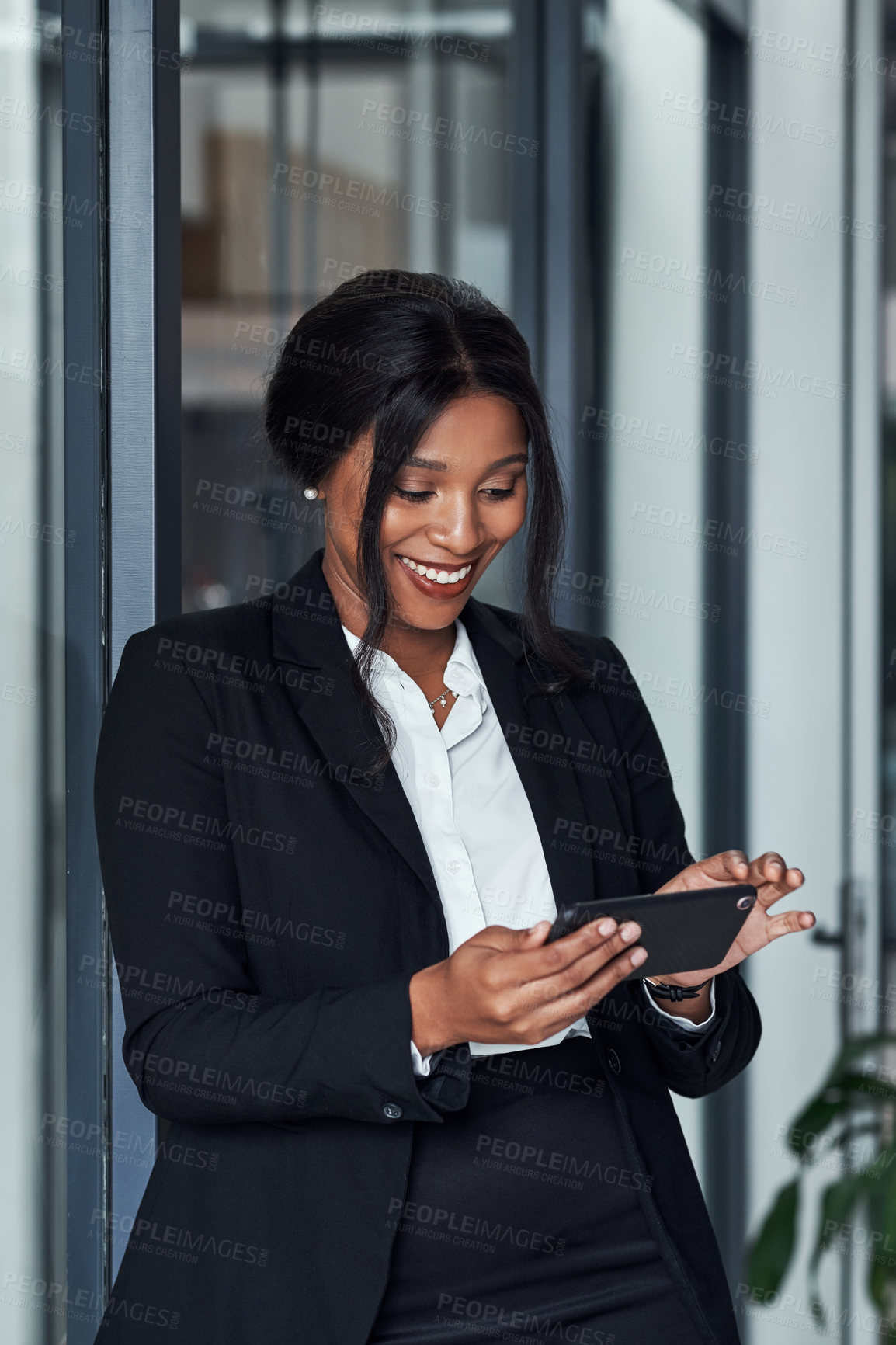 Buy stock photo Watch, video and black woman with phone in office with social media, post or scroll on break. Happy, employee and relax with online live stream, chat or communication in workplace with app or tech