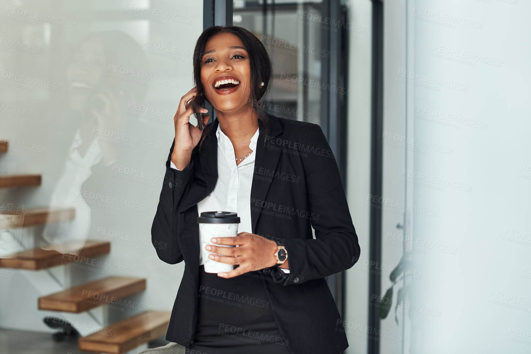 Buy stock photo Shot of a young businesswoman using a smartphone in a modern office