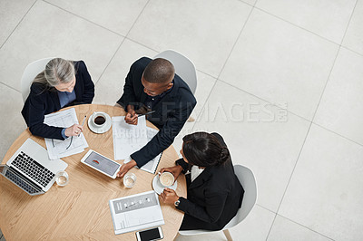 Buy stock photo Top view, staff and employees brainstorming, collaboration and planning with technology, documents and discussion. Business people, group and coworkers share ideas, website launch and online reading
