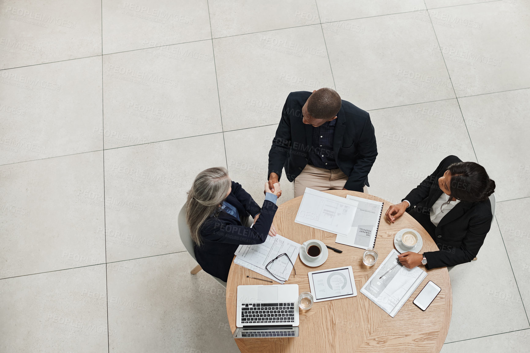 Buy stock photo Teamwork, above or business people shaking hands in meeting, b2b agreement and partnership. Group support, empower and financial advisor in office for job promotion, deal negotiation and opportunity