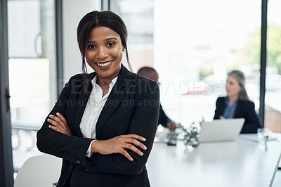 Buy stock photo Shot of a young businesswoman attending a meeting in a modern office