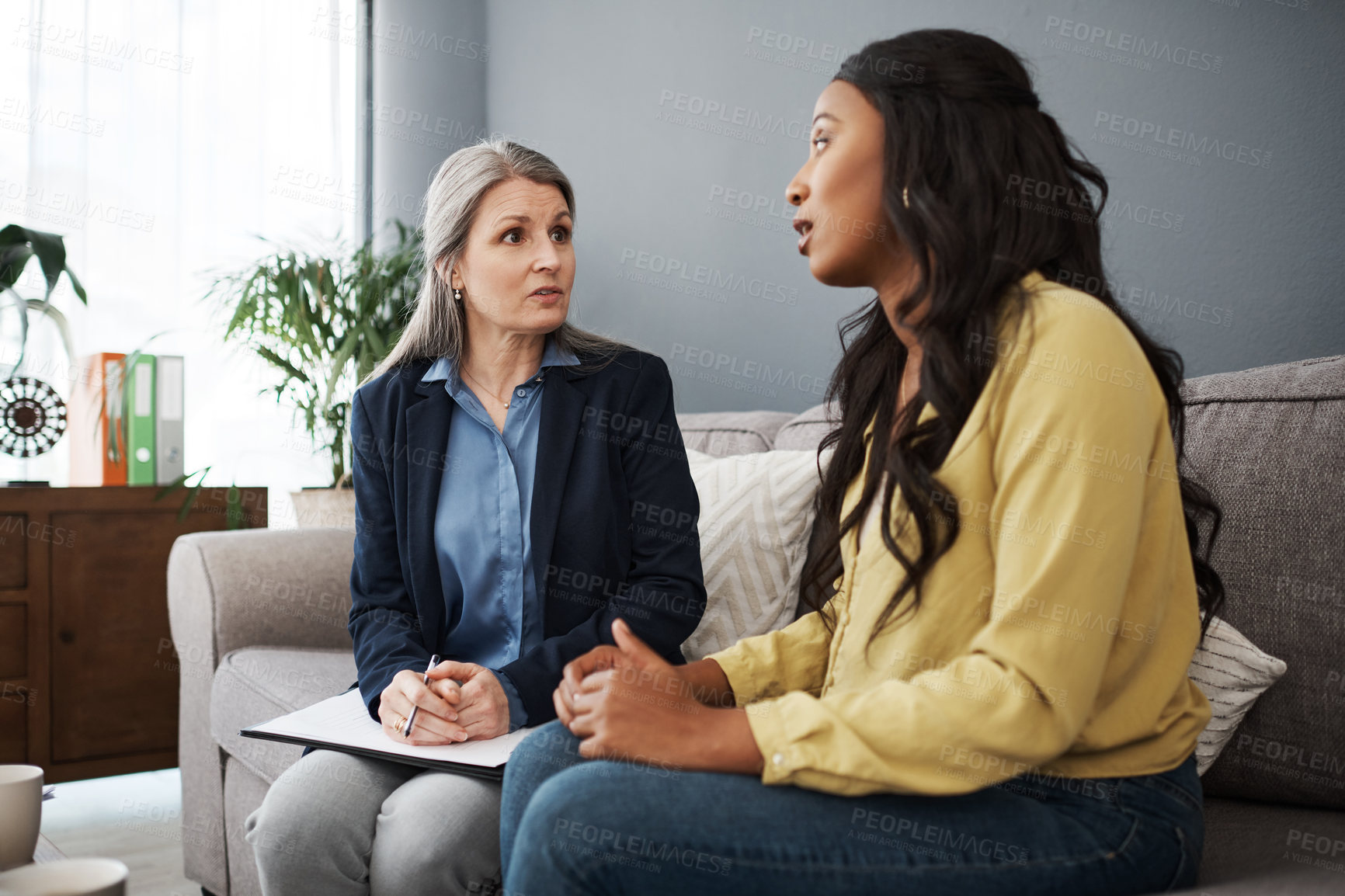 Buy stock photo Shot of a young woman having a meeting with her advisor
