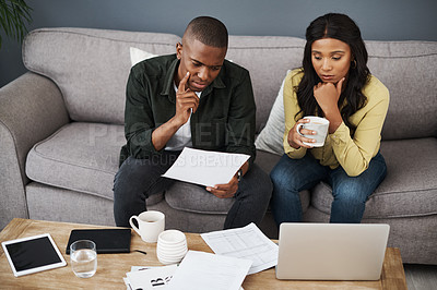 Buy stock photo Finance, laptop and stress with couple on sofa in living room of home for audit or tax review. Bankruptcy, computer or debt with man and woman reading documents in apartment for accounting or money