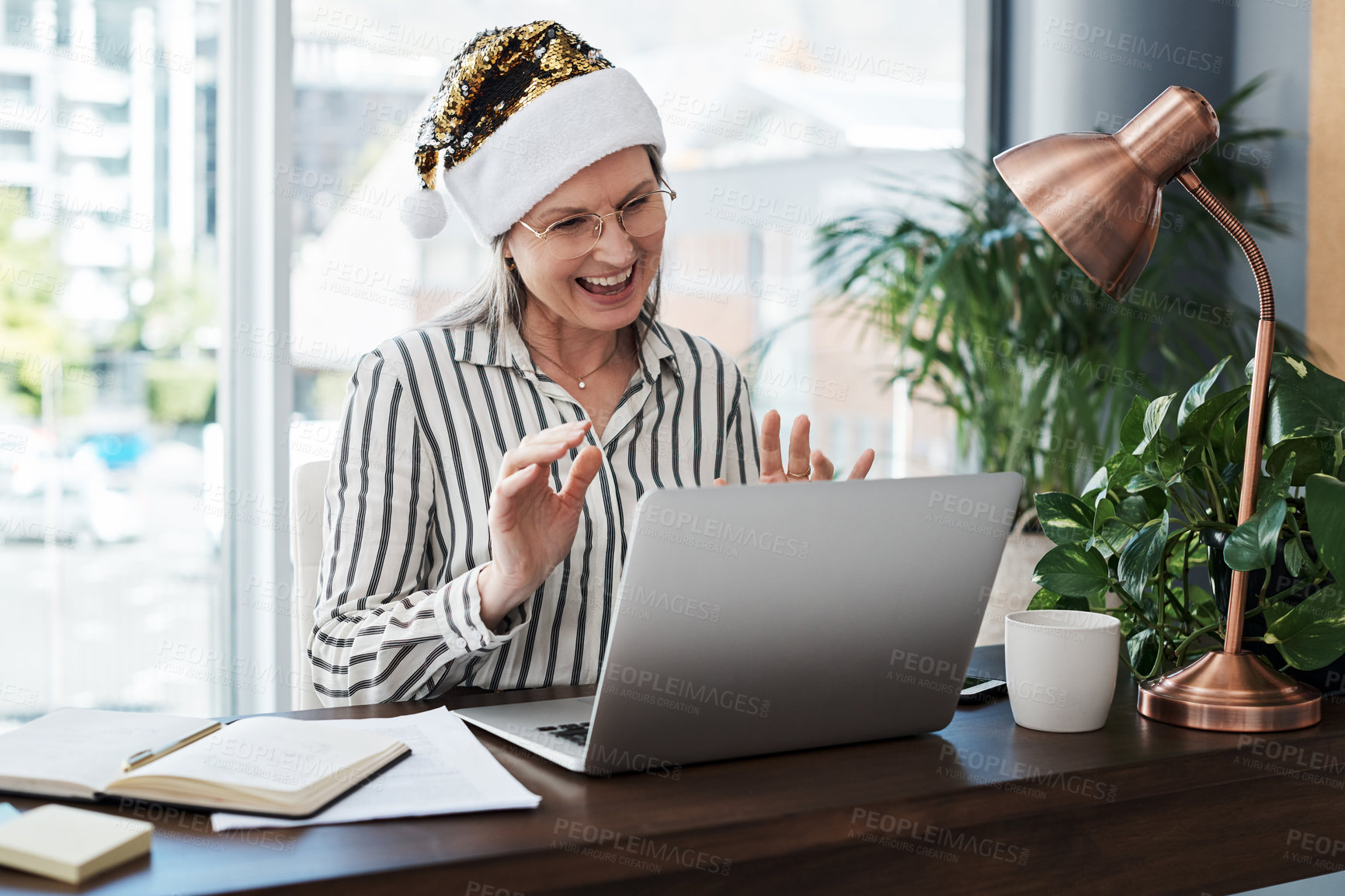 Buy stock photo Christmas, laptop and video call with business woman in office for virtual meeting or webinar. Computer, internet and management with mature employee in workplace for online meeting or training