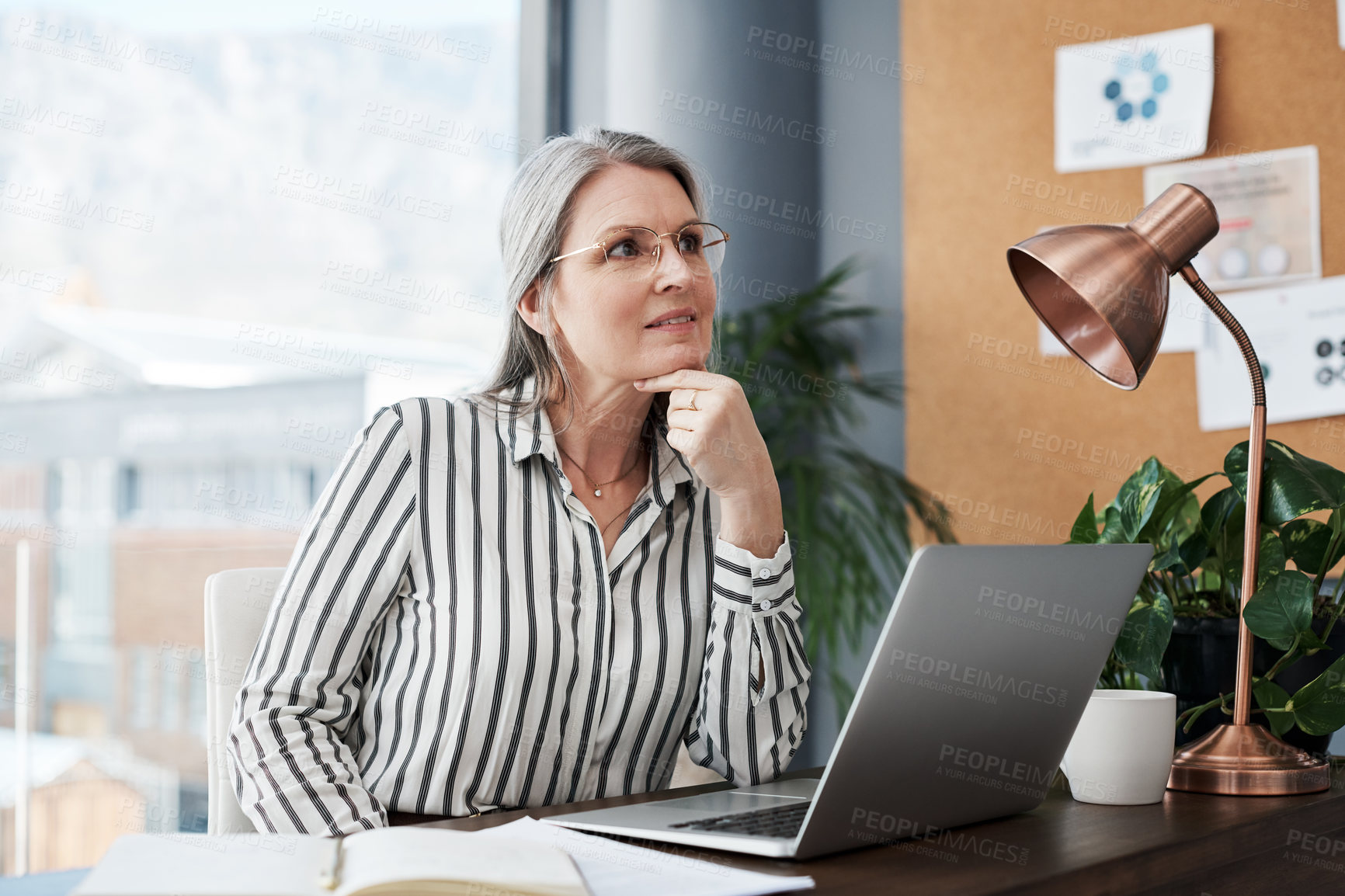 Buy stock photo Business woman, thinking and planning on computer in office for human resources ideas or goals. Mature worker or boss on laptop with vision and inspiration for employee management and career solution