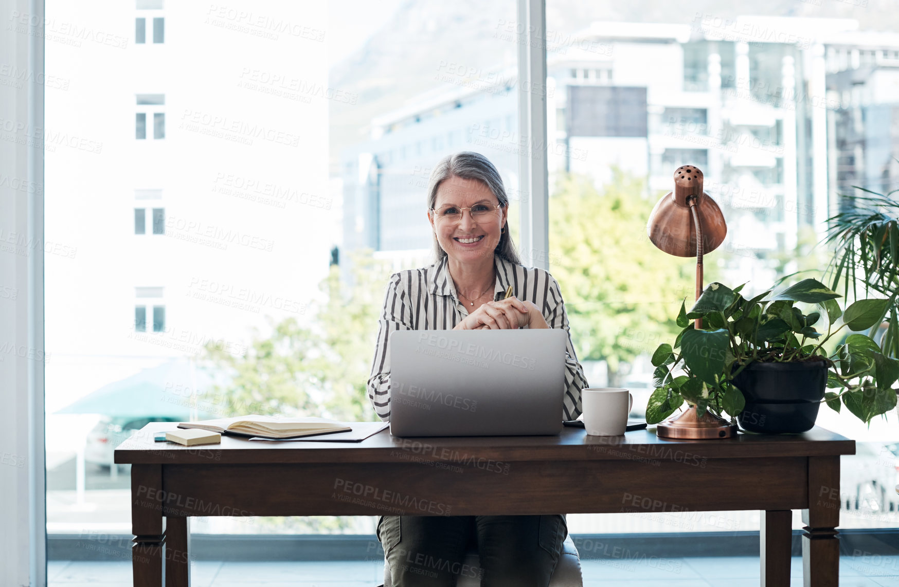 Buy stock photo Mature woman, portrait and laptop in office for agenda, communication and site for ideas research. Female person, sales consultant and networking proposal on email, online and project management