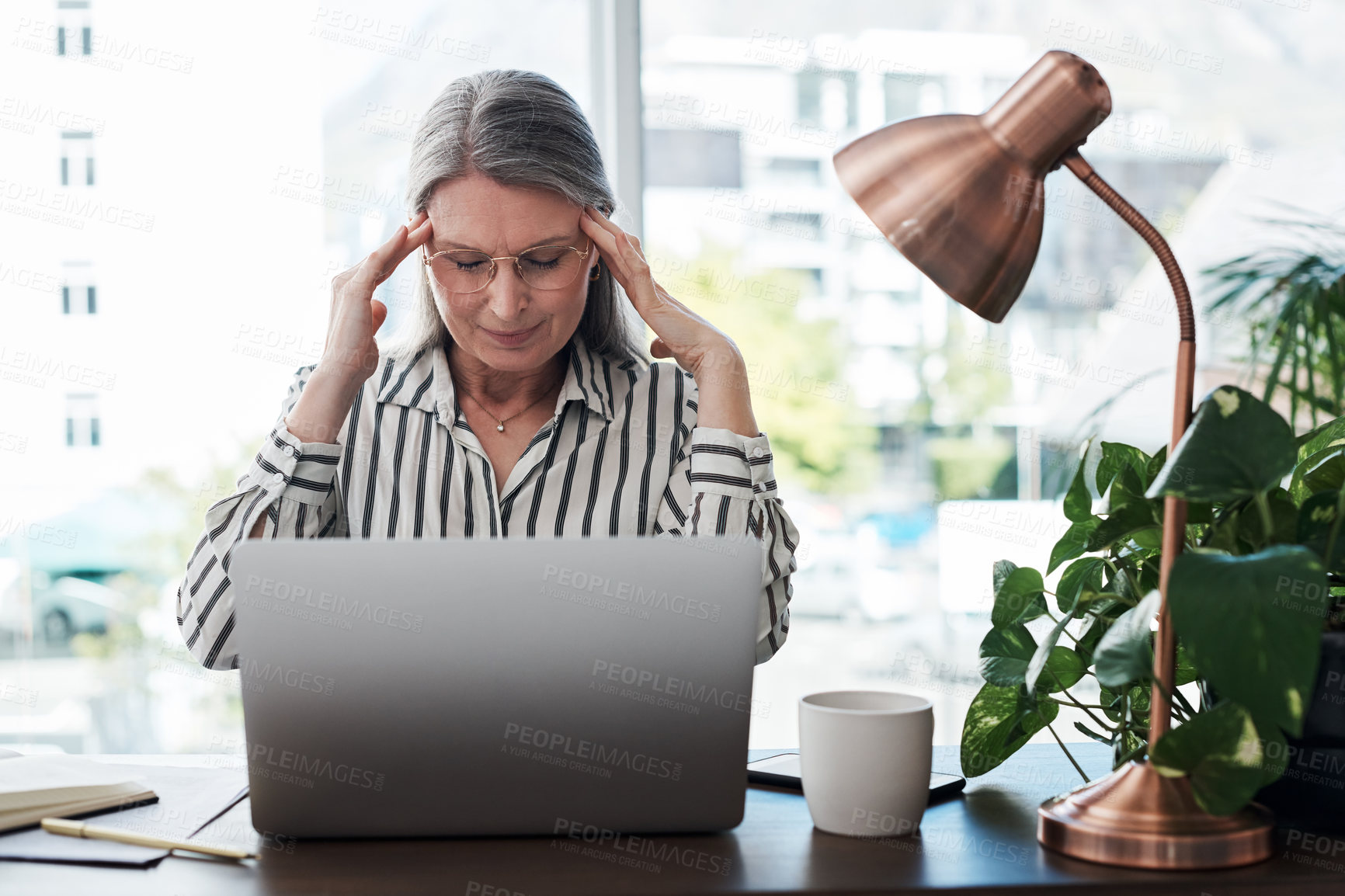 Buy stock photo Business woman, headache and stress on computer for deadline, mistake or error of human resource payroll. Mature worker or boss on laptop with migraine, pain or health risk in career, job and office