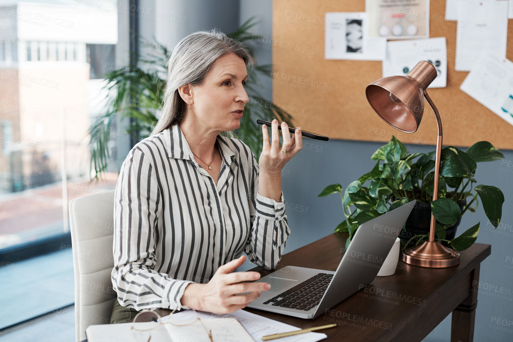 Buy stock photo Business woman, computer and voice call for communication, planning or network in public relations. Professional and mature worker talking on mobile or phone for contact with online clients in office