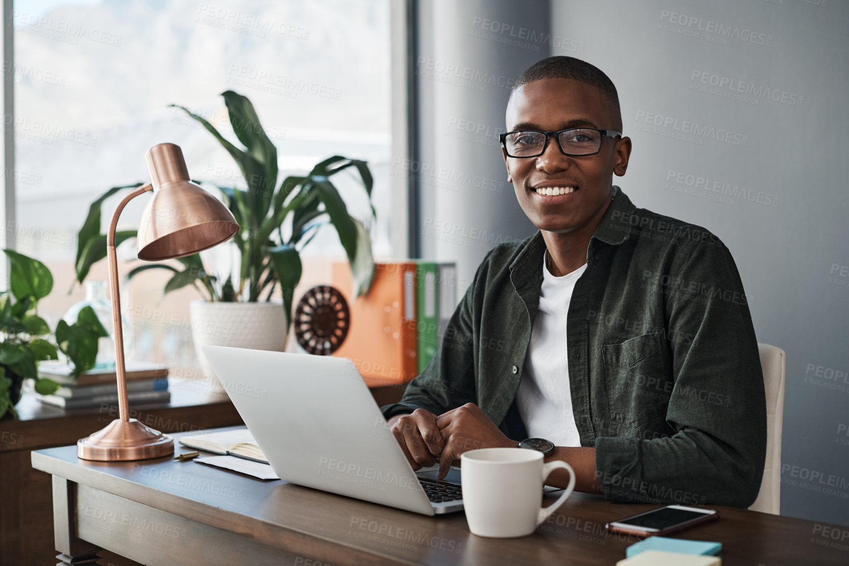 Buy stock photo Black, businessman and smile with laptop in portrait for confidence and pride in freelance job. Happy, male person and copywriter with computer for writing blog, articles and email feedback in office