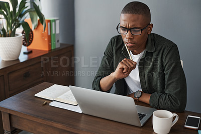 Buy stock photo Shot of a young businessman planning while working from home