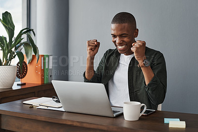 Buy stock photo Shot of a young businessman celebrating while working from home
