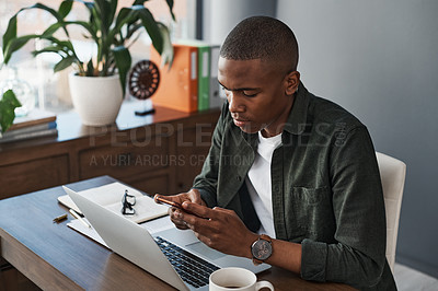 Buy stock photo Shot of a young businessman using his smartphone to send a text