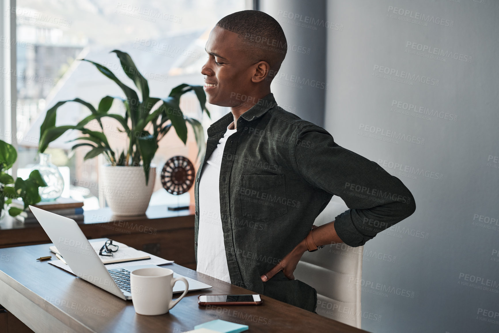 Buy stock photo Man, office and back pain with laptop at desk with injury or health problem with stress or anxiety. Burnout, muscle and overworked copywriter in company with tired joint, inflammation and fatigue 