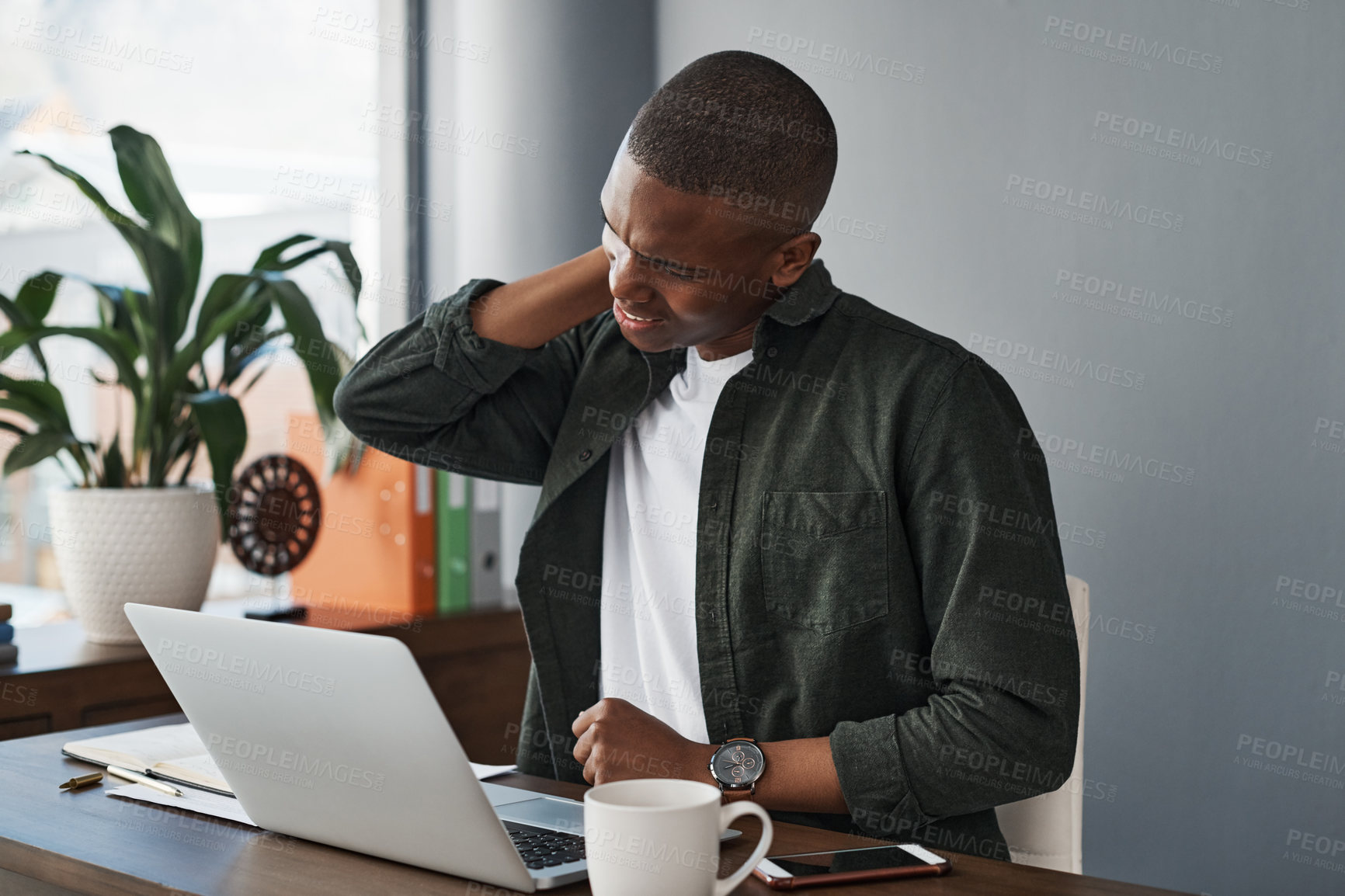 Buy stock photo Man, office and neck pain with laptop at desk with injury or health problem with stress or anxiety. Overworked, muscle and copywriter fatigued in company with tired, social media and burnout in work.