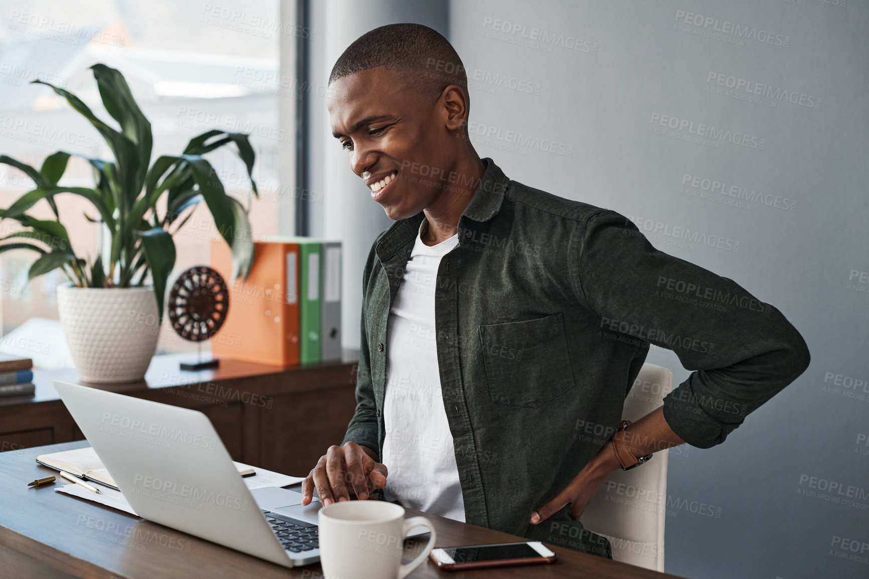 Buy stock photo Office, black man and back pain with laptop at desk with injury or health problem with stress or anxiety. Muscle, burnout and overworked copywriter in company with tired, social media and fatigue