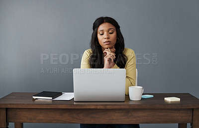 Buy stock photo Shot of a young businesswoman thinking up ideas while working