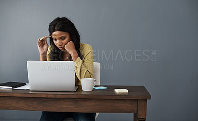 Buy stock photo Shot of a young businesswoman thinking up ideas while working