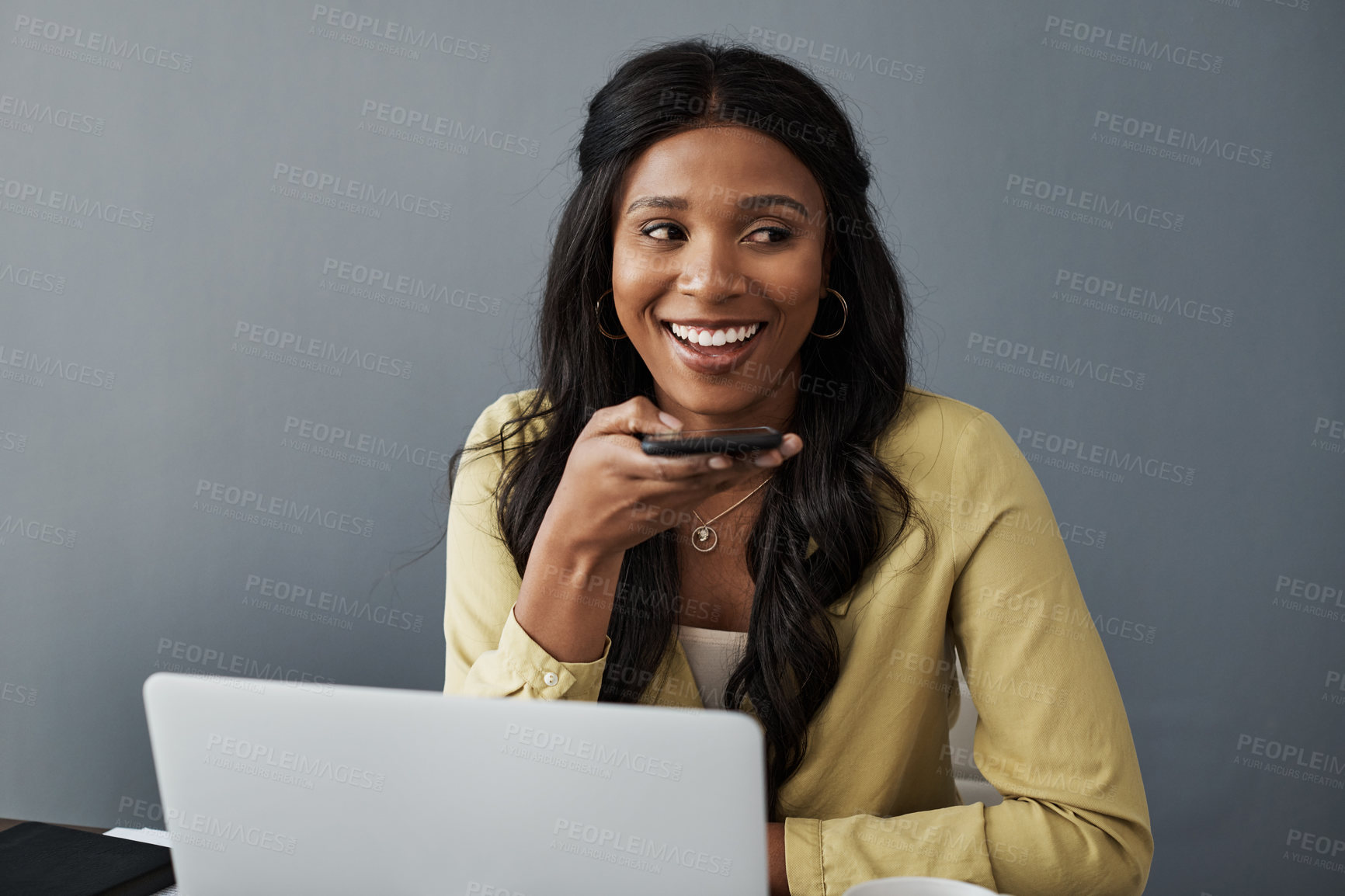 Buy stock photo Shot of a young businesswoman using her smartphone to make a call