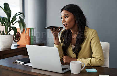 Buy stock photo Shot of a young businesswoman using her smartphone to make a call