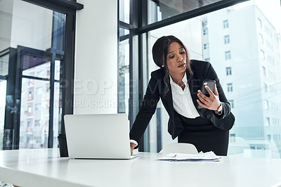 Buy stock photo Laptop, phone and busy woman in office for financial planning, networking and deadline for tax audit. Business, computer and consultant with smartphone, paperwork and schedule for project management