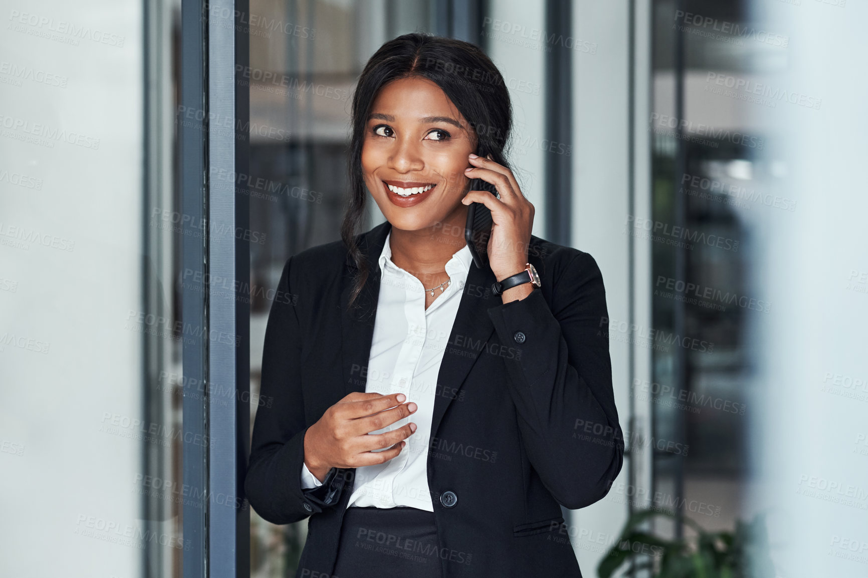 Buy stock photo Happy black woman, office and business discussion with phone call by window for proposal or friendly chat. African, female person or financial advisor talking on mobile smartphone for conversation