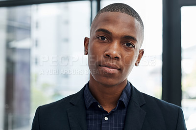 Buy stock photo Portrait of a young businessman working in a modern office