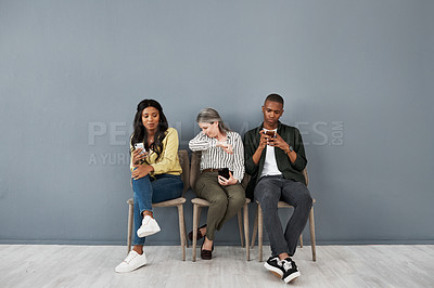 Buy stock photo Shot of a mature woman with poor hygiene between two distancing people against a grey wall