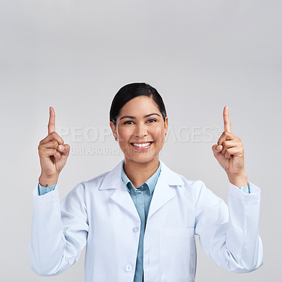 Buy stock photo Cropped portrait of an attractive young female scientist gesturing size in studio against a grey background