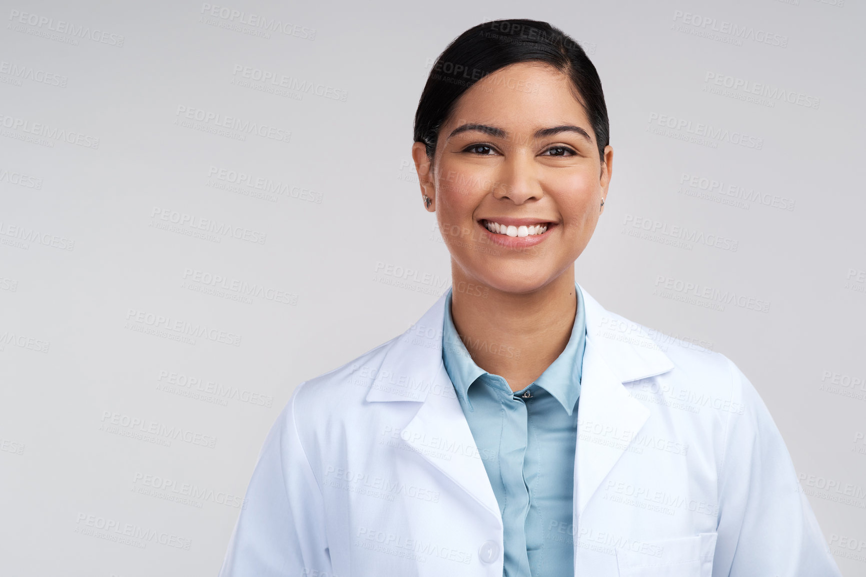 Buy stock photo Cropped portrait of an attractive young female scientist posing in studio against a grey background