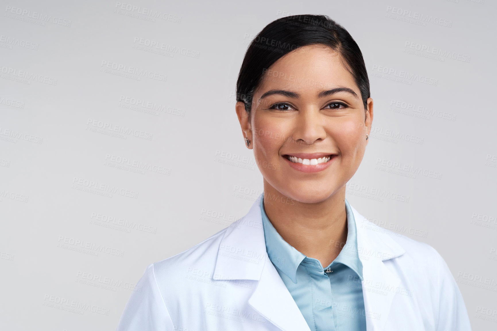 Buy stock photo Cropped portrait of an attractive young female scientist posing in studio against a grey background