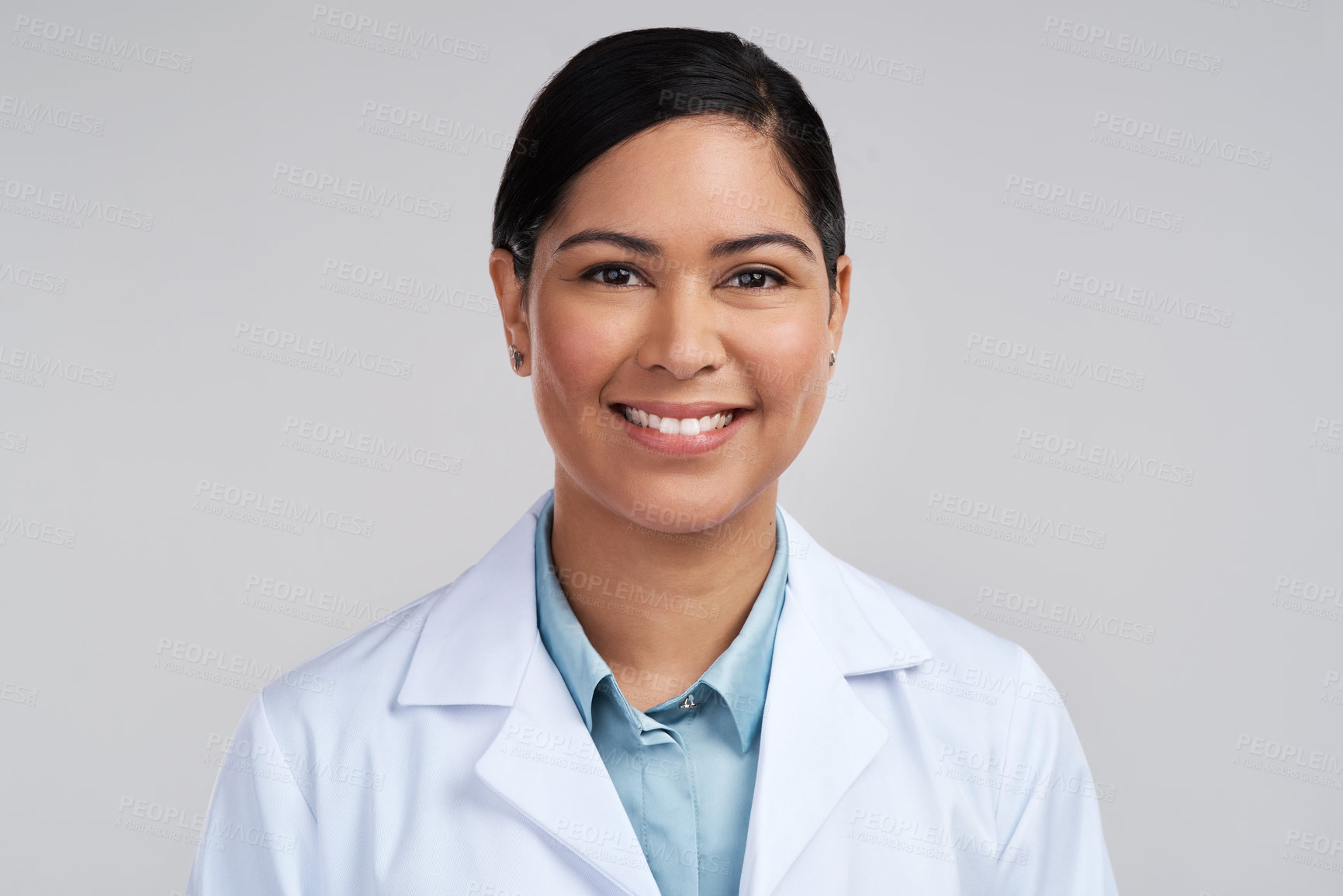 Buy stock photo Cropped portrait of an attractive young female scientist posing in studio against a grey background