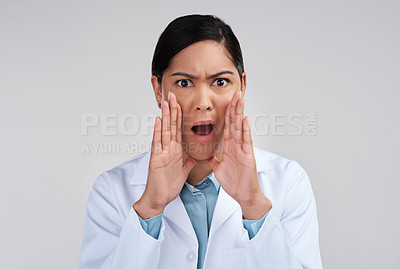 Buy stock photo Cropped portrait of an attractive young female scientist looking shocked in studio against a grey background