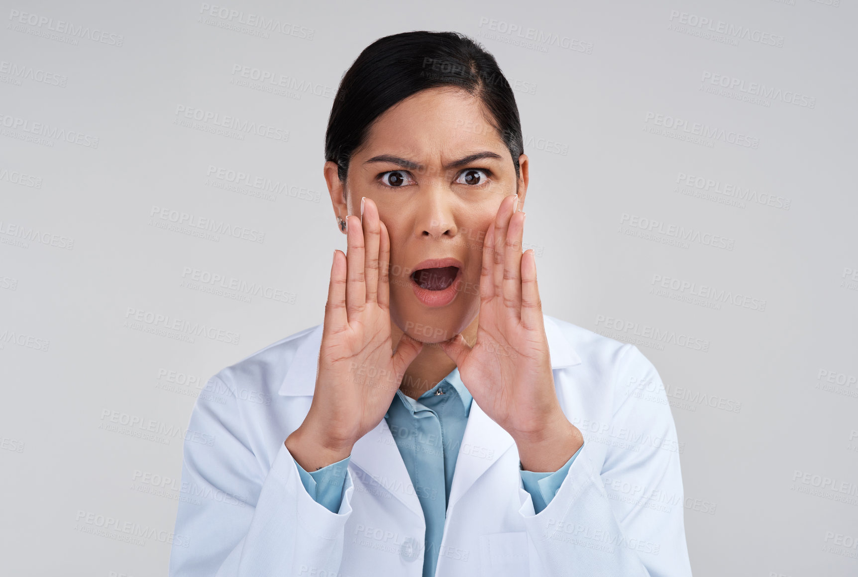 Buy stock photo Cropped portrait of an attractive young female scientist looking shocked in studio against a grey background