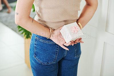 Buy stock photo Hands, gift and person with box for surprise in home, back and hiding package with rear view in apartment alone. Present, ribbon and woman with secret for celebration, holiday or event for giving