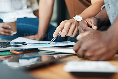 Buy stock photo Shot of a group of unrecognizable businesspeople working together in an office