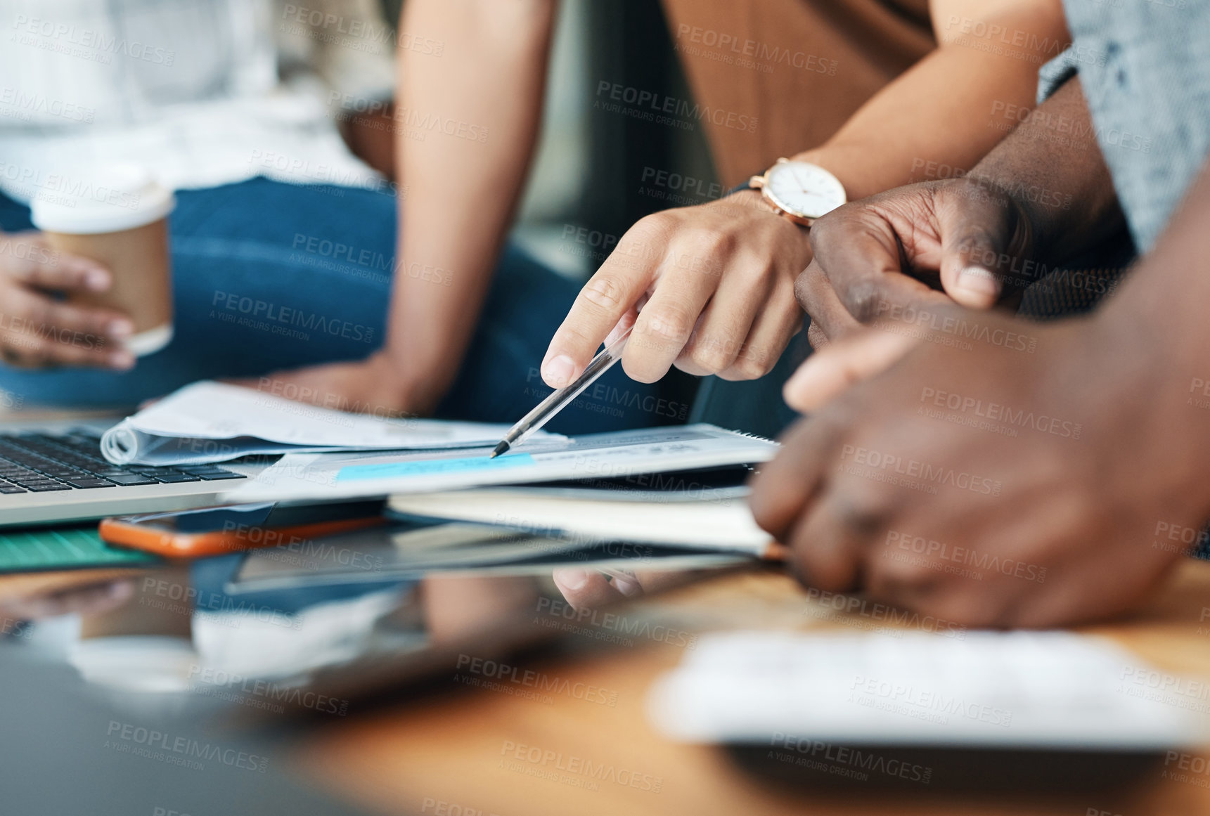 Buy stock photo Shot of a group of unrecognizable businesspeople working together in an office