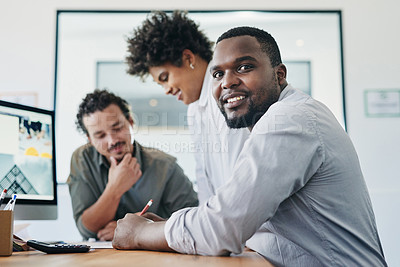 Buy stock photo Shot of a group of young businesspeople having a discussion in an office