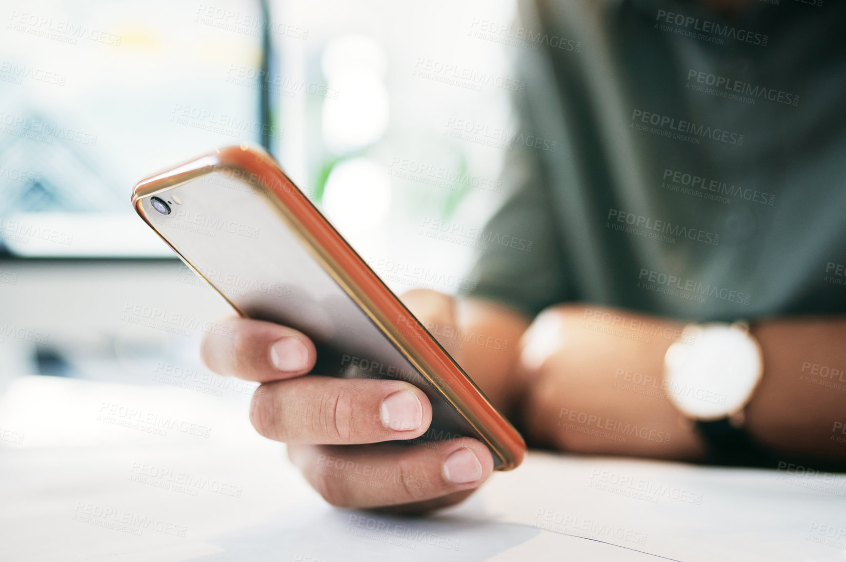 Buy stock photo Shot of an unrecognizable businessperson using a cellphone in an office