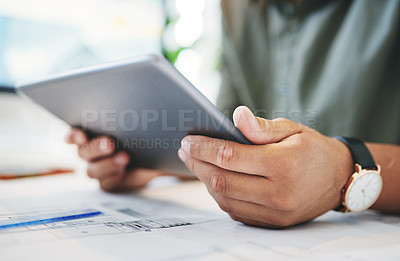 Buy stock photo Shot of an unrecognizable businessperson using a digital tablet in an office