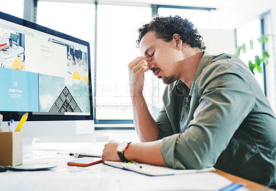 Buy stock photo Shot of a young businessman in pain in an office