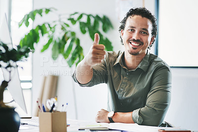 Buy stock photo Shot of a young businessman showing a thumbs up in an office